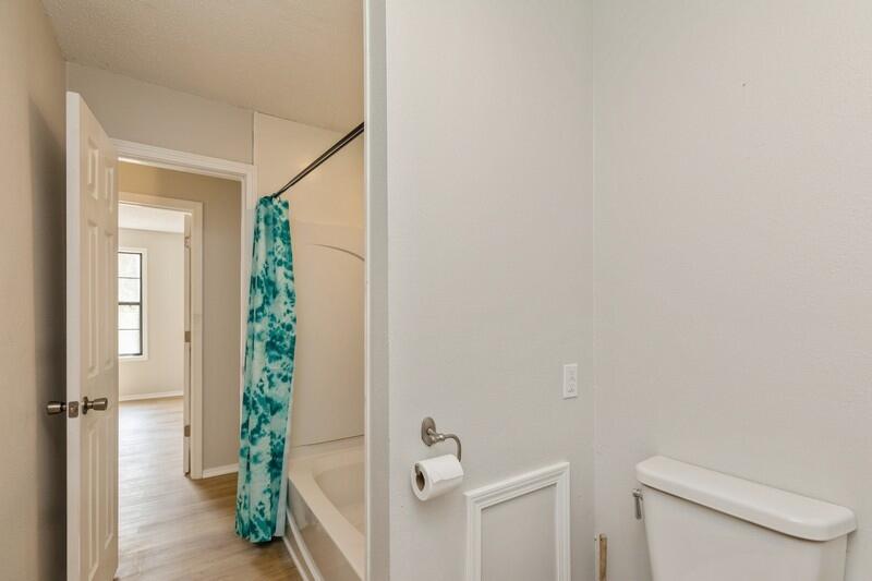 5867 Oak Hill Road Crestview, FL 32536 - Photo 23 of 33 a bathroom with a toilet and a shower