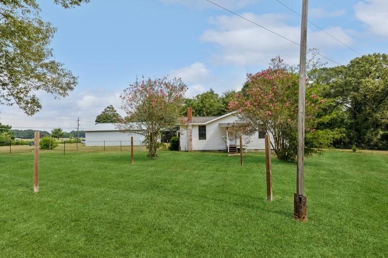 5867 Oak Hill Road Crestview, FL 32536 - Photo 4 of 33 a house view with a garden space