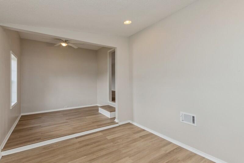 5867 Oak Hill Road Crestview, FL 32536 - Photo 9 of 33 a view of an empty room with wooden floor