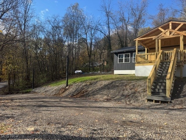 2445 McCord Hill Road Wellsburg, WV 26070 - Photo 4 of 37 View of yard featuring stairs and a porch