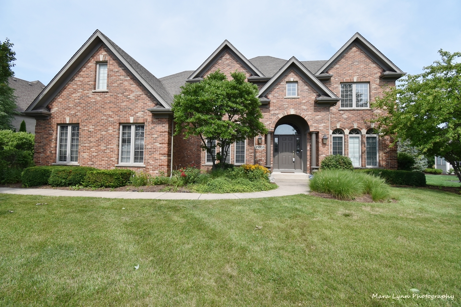 3N853 Walt Whitman Road Campton Hills, IL 60175 - Photo 1 of 48 a front view of a house with a yard and garage