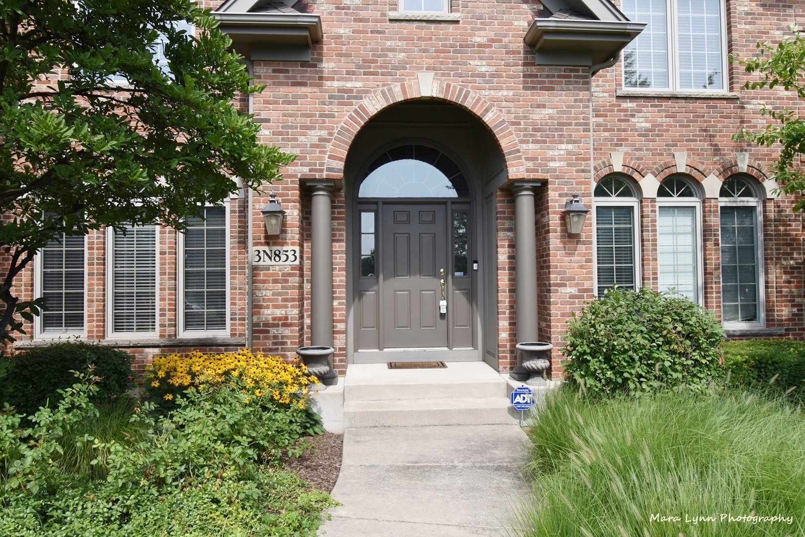 3N853 Walt Whitman Road Campton Hills, IL 60175 - Photo 4 of 48 a front view of a house with a garden