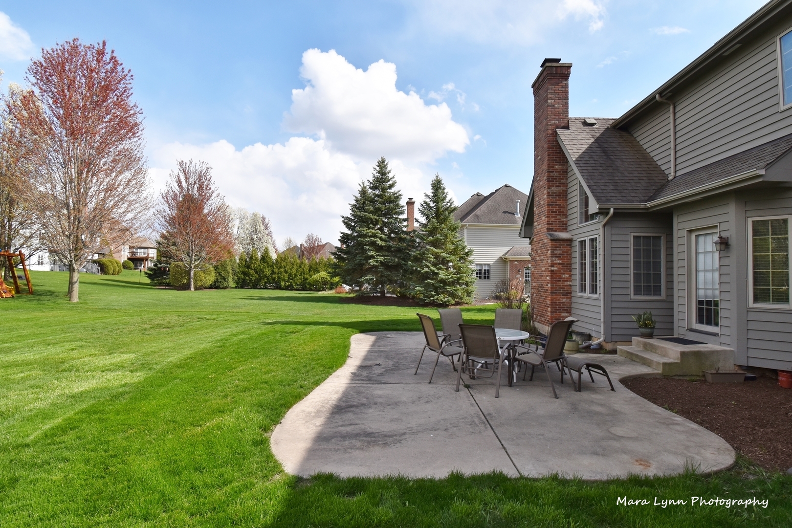 3N853 Walt Whitman Road Campton Hills, IL 60175 - Photo 48 of 48 a view of a patio with table and chairs potted plants and a large tree