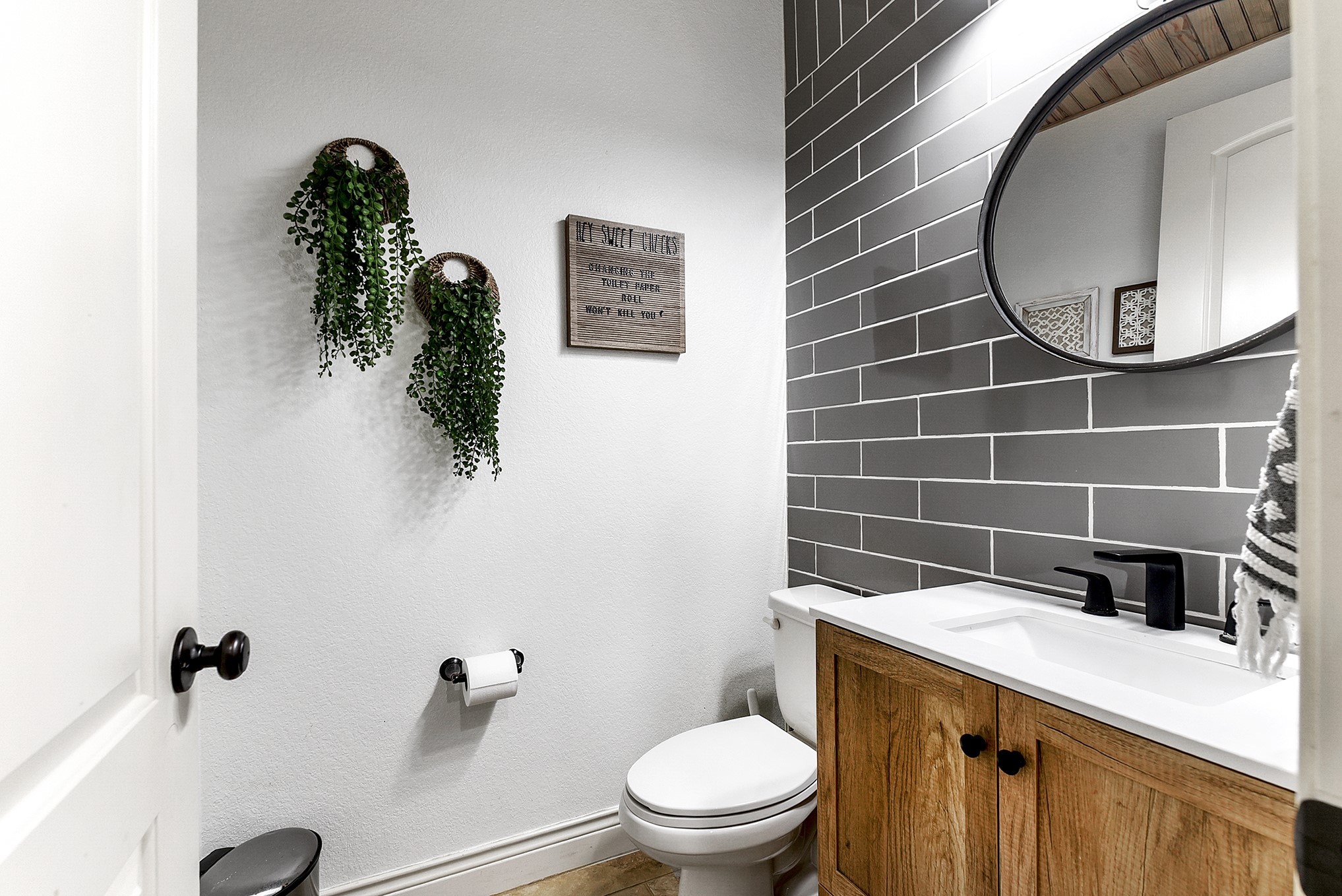 2939 Bobby Jones Road Katy, TX 77494 - Photo 41 of 50 a bathroom with a toilet sink vanity and mirror