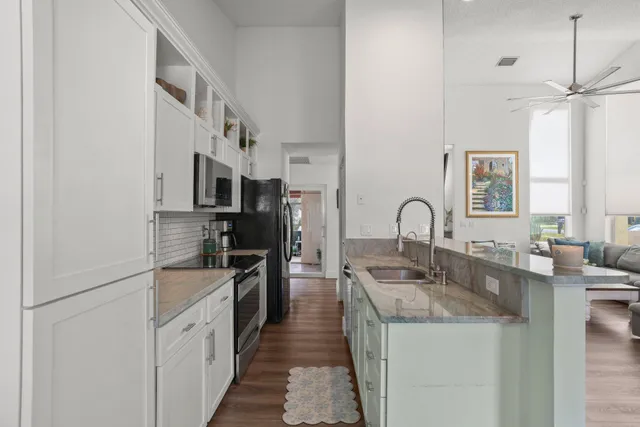 a bathroom with a double vanity sink mirror and shower