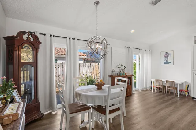 a view of hallway with wooden floor