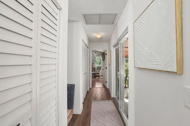 an aerial view of residential houses with outdoor space and parking