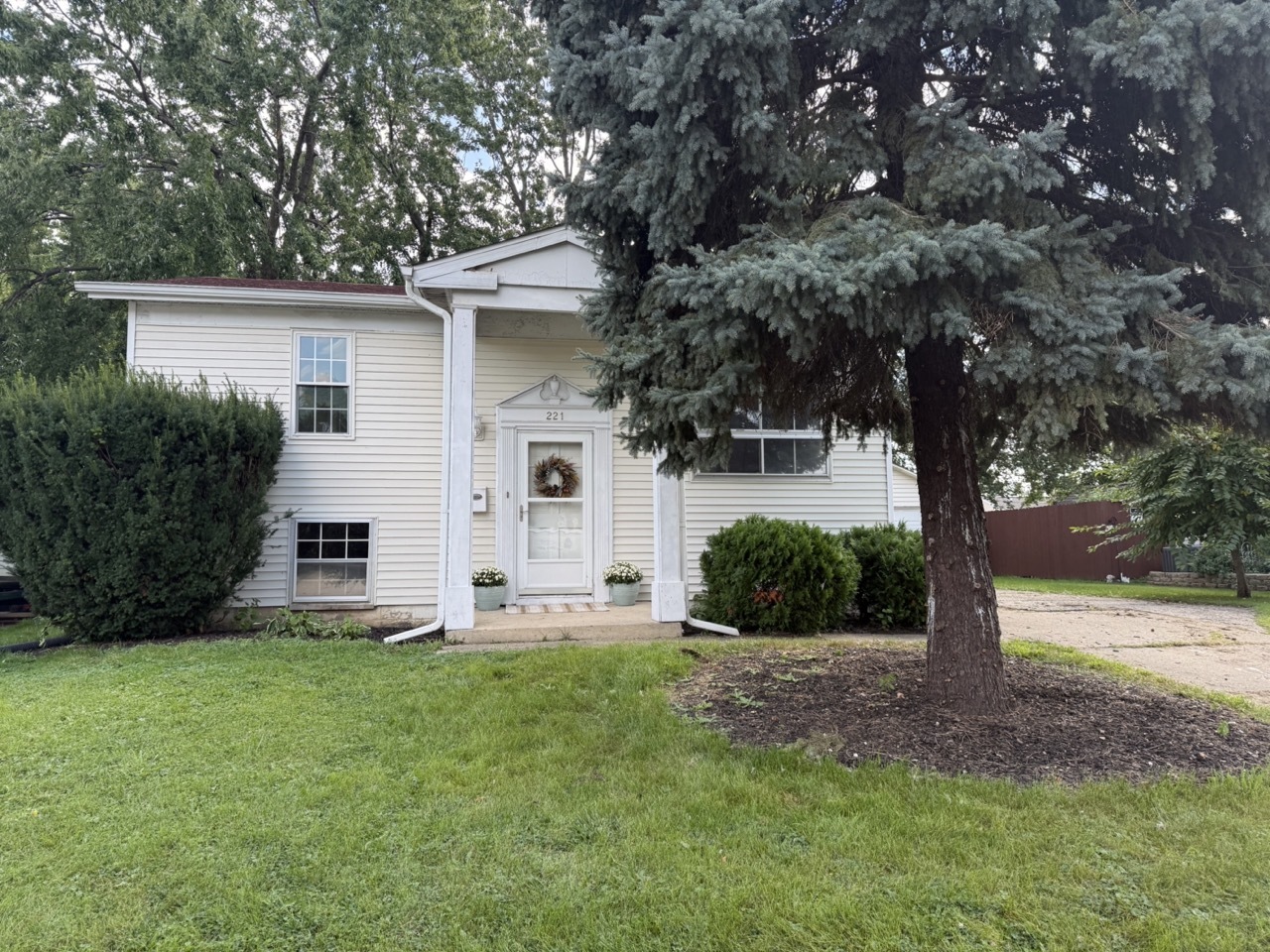 221 Murphy Drive Romeoville, IL 60446 - Photo 13 of 13 a front view of house with yard and green space