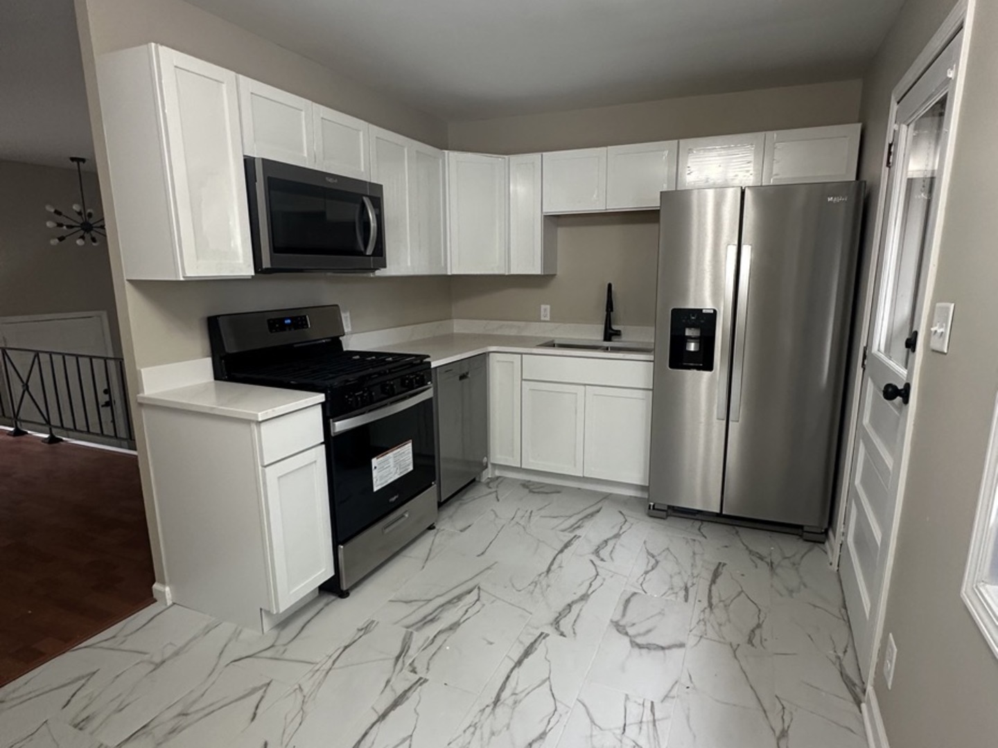 221 Murphy Drive Romeoville, IL 60446 - Photo 3 of 13 a kitchen with a sink stove and refrigerator