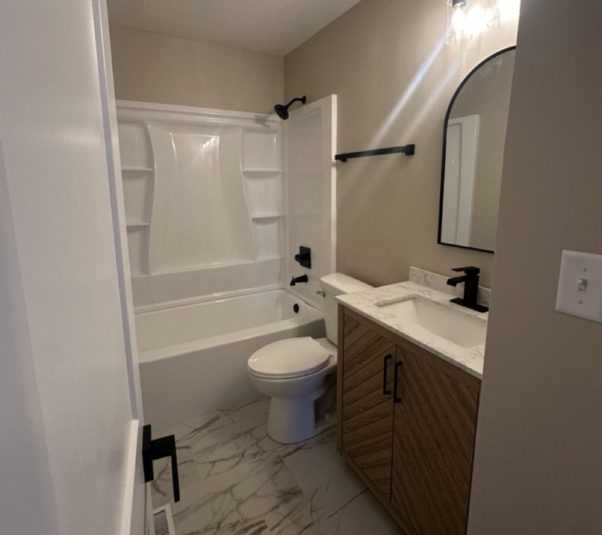 221 Murphy Drive Romeoville, IL 60446 - Photo 4 of 13 a bathroom with a sink toilet and shower