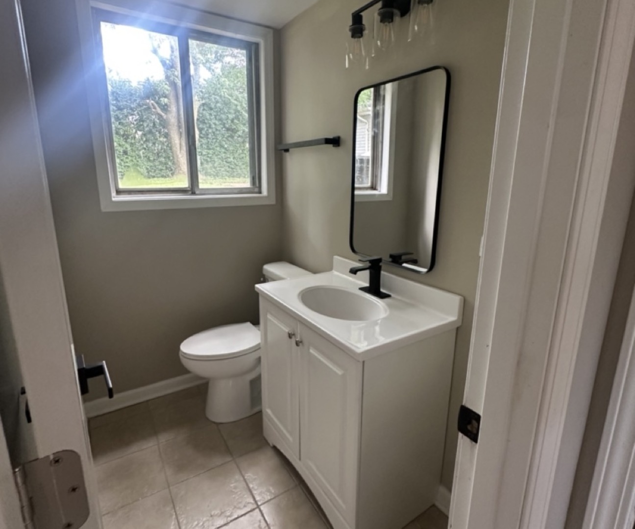 221 Murphy Drive Romeoville, IL 60446 - Photo 9 of 13 a bathroom with a toilet sink and mirror
