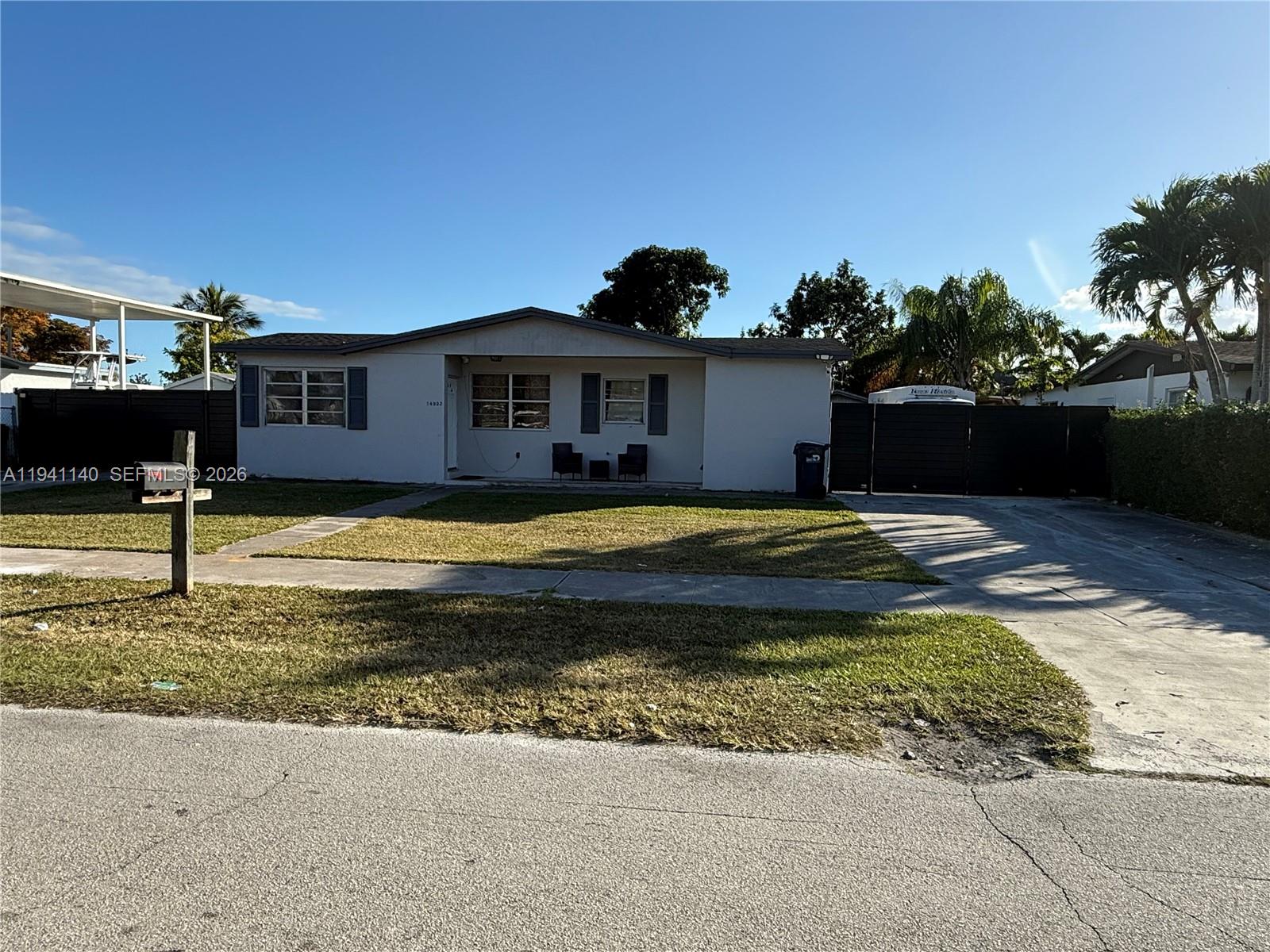 14932 Southwest 297th Terrace Homestead, FL 33033 - Photo 1 of 9 a view of a house with swimming pool