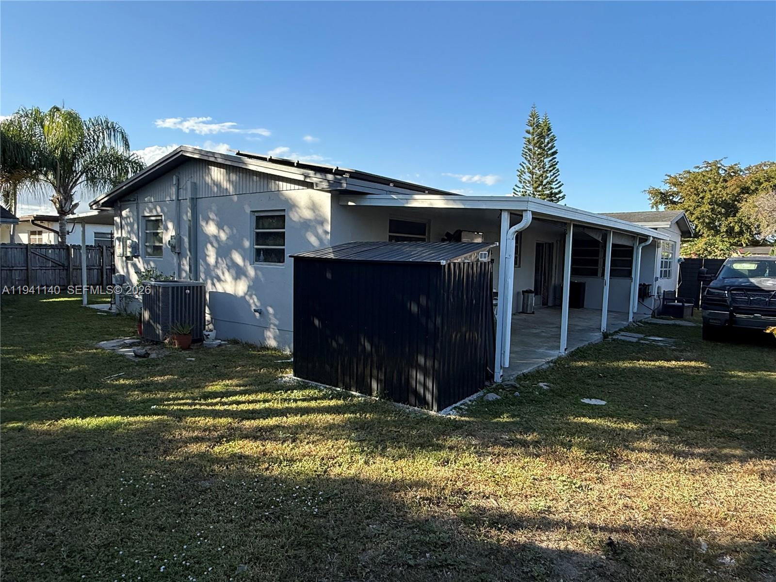 14932 Southwest 297th Terrace Homestead, FL 33033 - Photo 3 of 9 a view of a house with a yard
