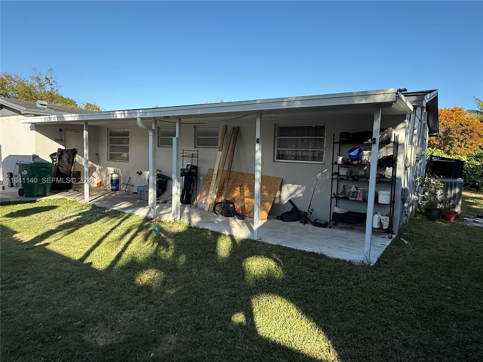 14932 Southwest 297th Terrace Homestead, FL 33033 - Photo 5 of 9 a view of a house with swimming pool and sitting area