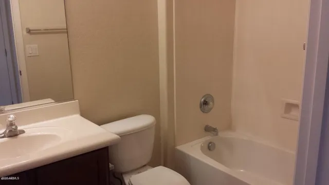 a bathroom with a sink a toilet and bathtub