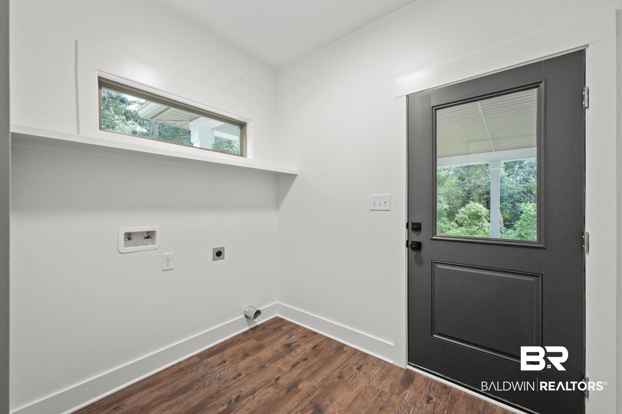 12412 Mannich Lane Foley, AL 36535 - Photo 11 of 23 Laundry room with washer hookup, a healthy amount of sunlight, dark hardwood / wood-style floors, and hookup for an electric dryer