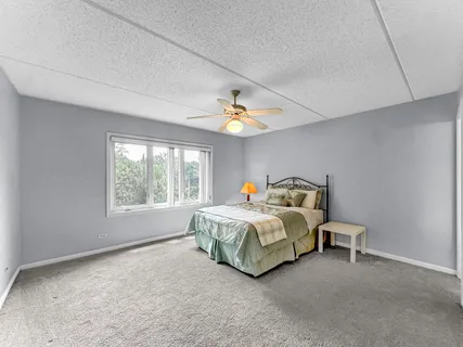 a bed room with a bed and a window
