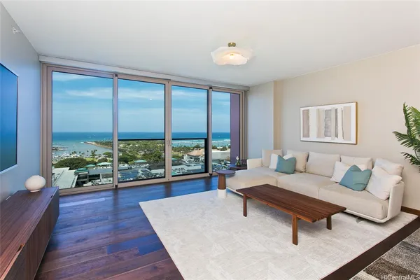 a living room with furniture and a large window
