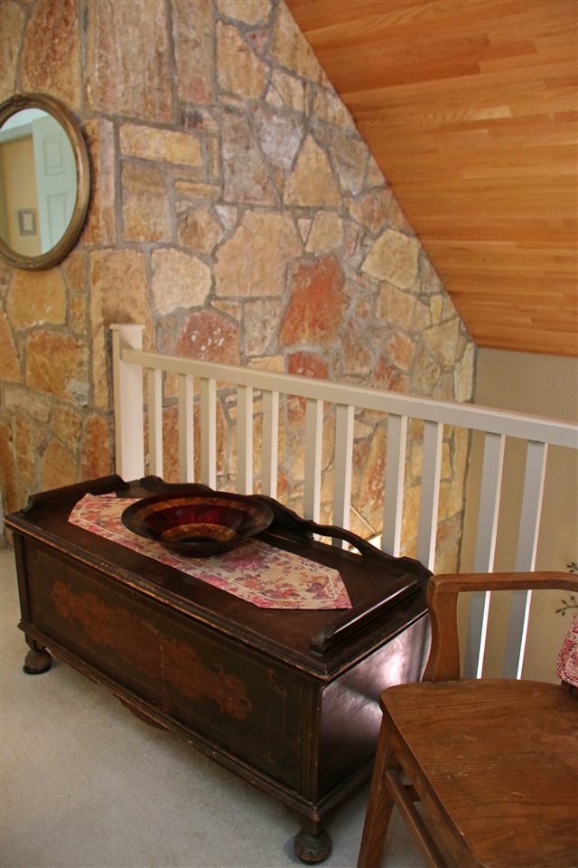 42 Eureka Mill Road Staunton, VA 24401 - Photo 15 of 29 a bed sitting in a roof next to a blue wall