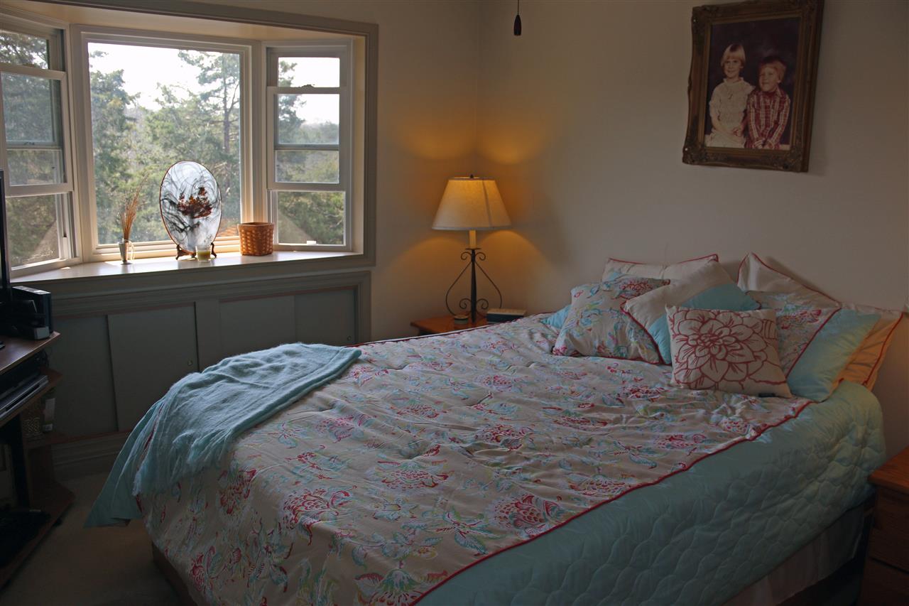 42 Eureka Mill Road Staunton, VA 24401 - Photo 19 of 29 a bed sitting in a bedroom next to a window