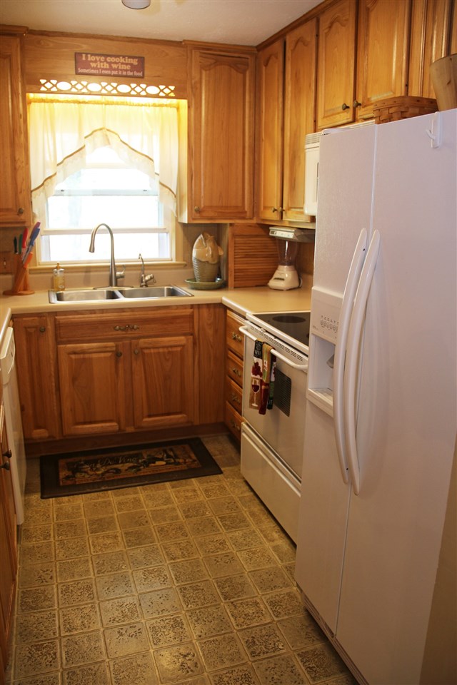 42 Eureka Mill Road Staunton, VA 24401 - Photo 7 of 29 a kitchen with granite countertop a refrigerator and a sink
