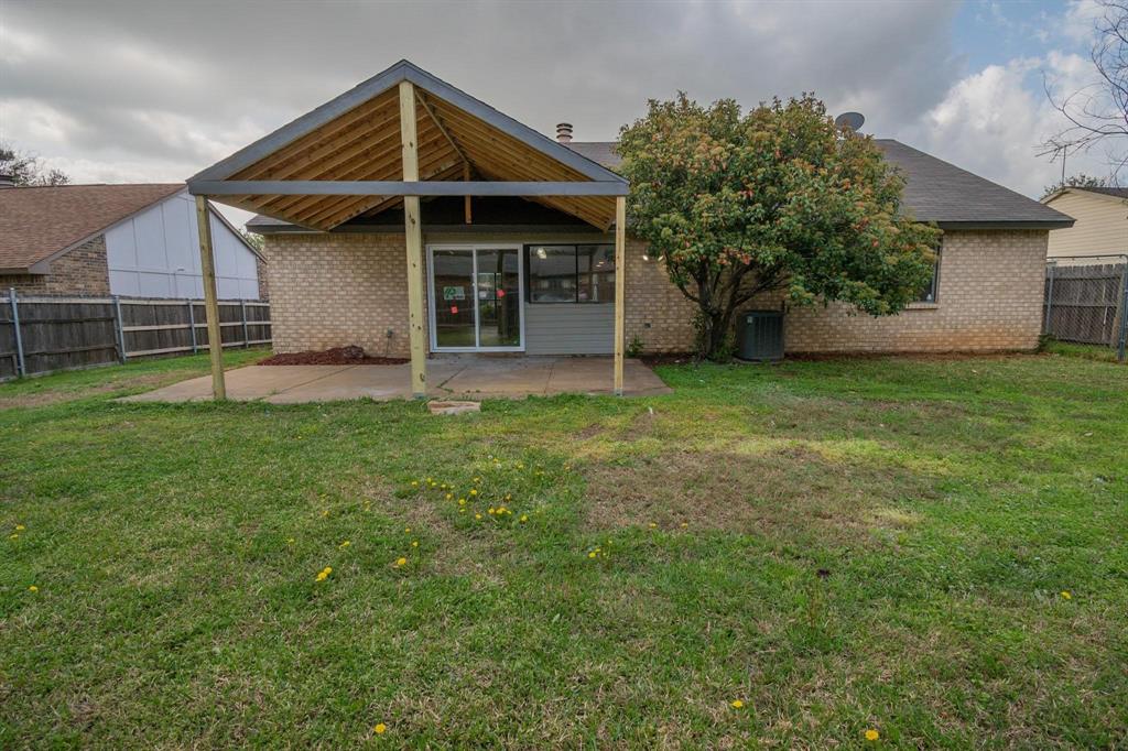 3825 Hackberry Lane Bedford, TX 76021 - Photo 24 of 24 a view of a house with a yard
