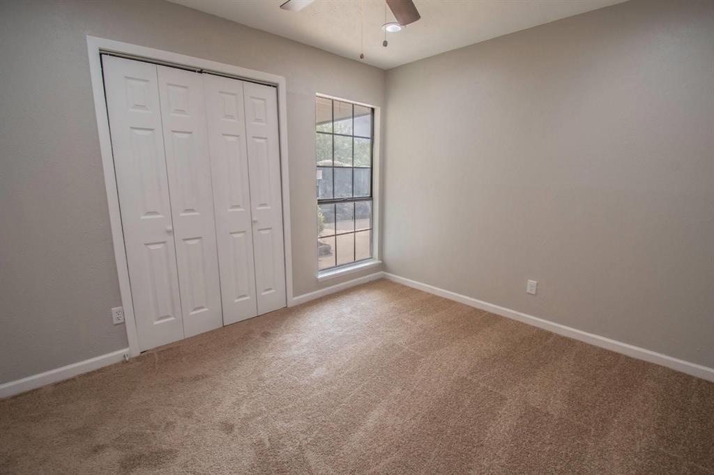 3825 Hackberry Lane Bedford, TX 76021 - Photo 9 of 24 an empty room with windows