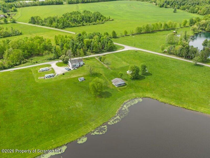 9-17 Vago Road Tunkhannock, PA 18657 - Photo 56 of 57 a view of a lake with a big yard