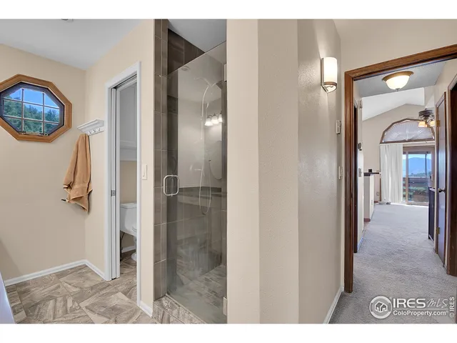 a bedroom with furniture and a chandelier