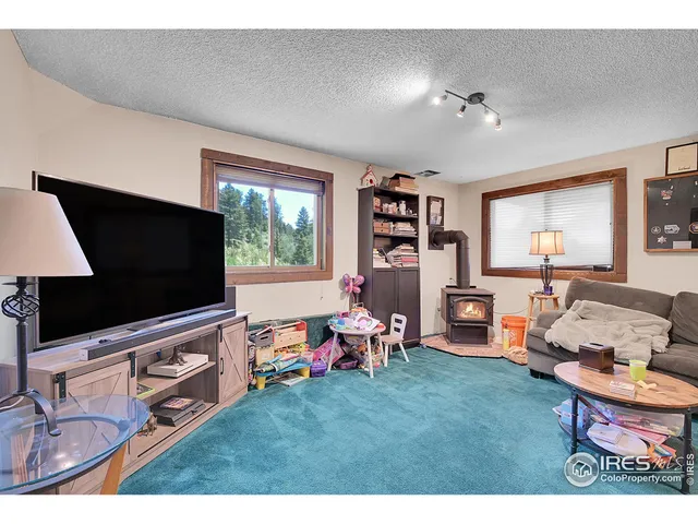 a large bedroom with a bed and a large mirror in it