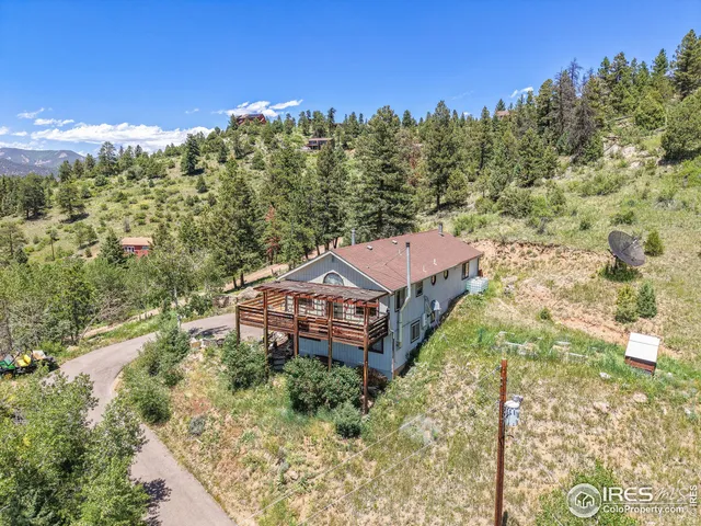 an aerial view of residential house with outdoor space