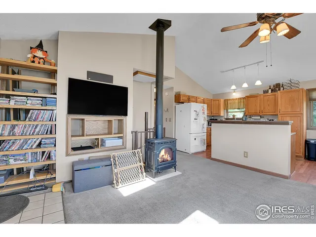 a kitchen with stainless steel appliances granite countertop a sink dishwasher stove refrigerator and cabinets