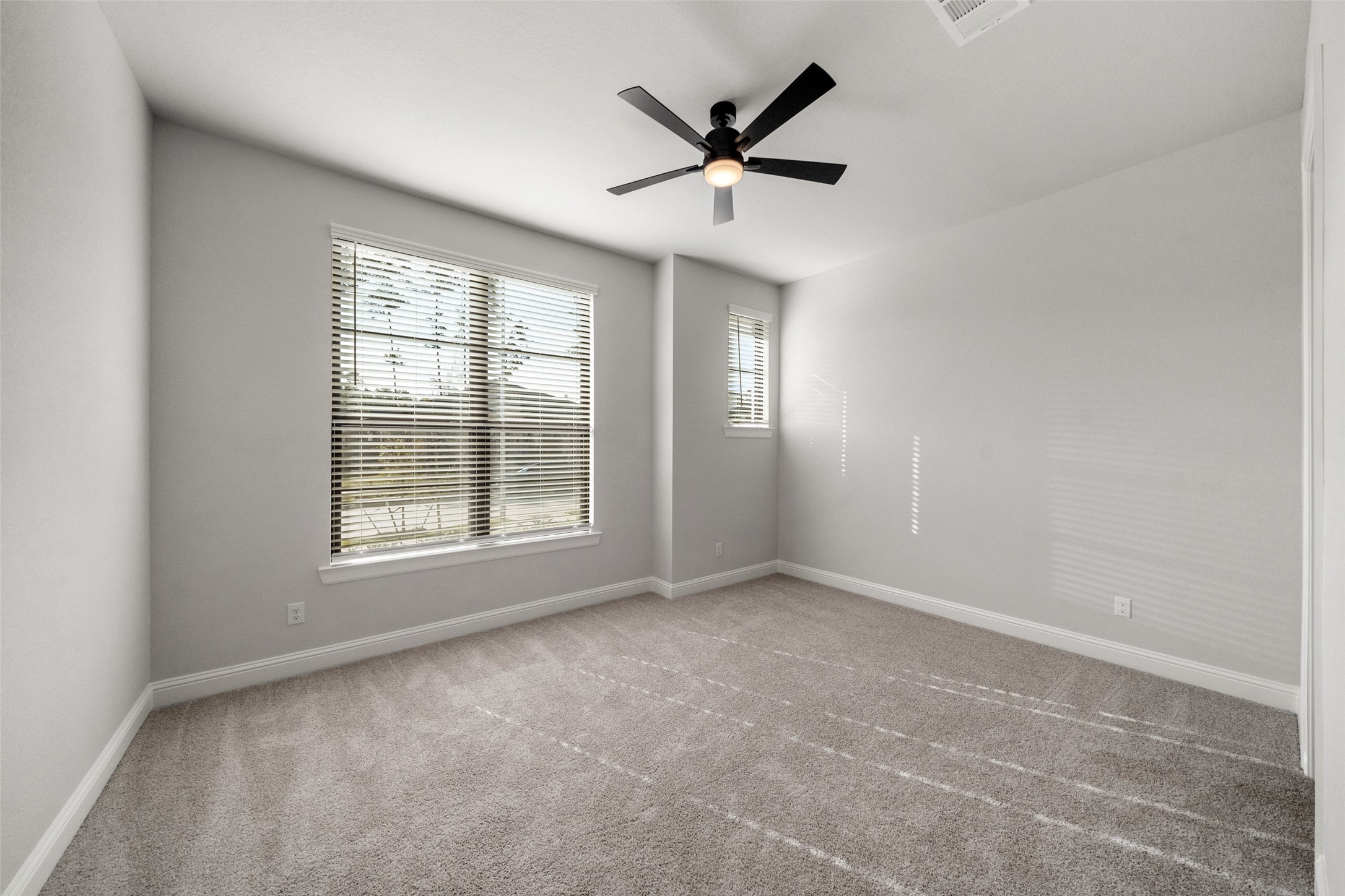 15464 Ringbill Way Magnolia, TX 77354 - Photo 9 of 37 a view of a livingroom with a ceiling fan and window