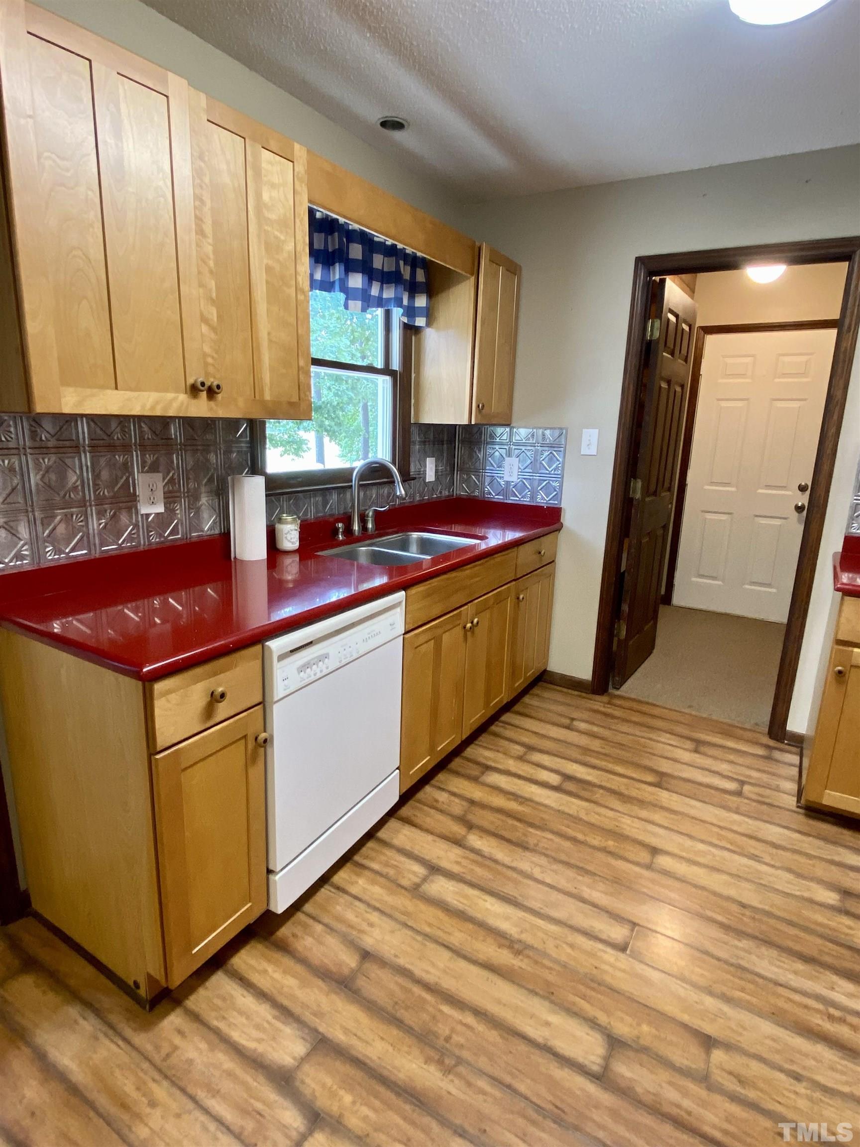 1887 Burnside Road Oxford, NC 27565 - Photo 13 of 42 a kitchen with stainless steel appliances granite countertop a sink stove and cabinets