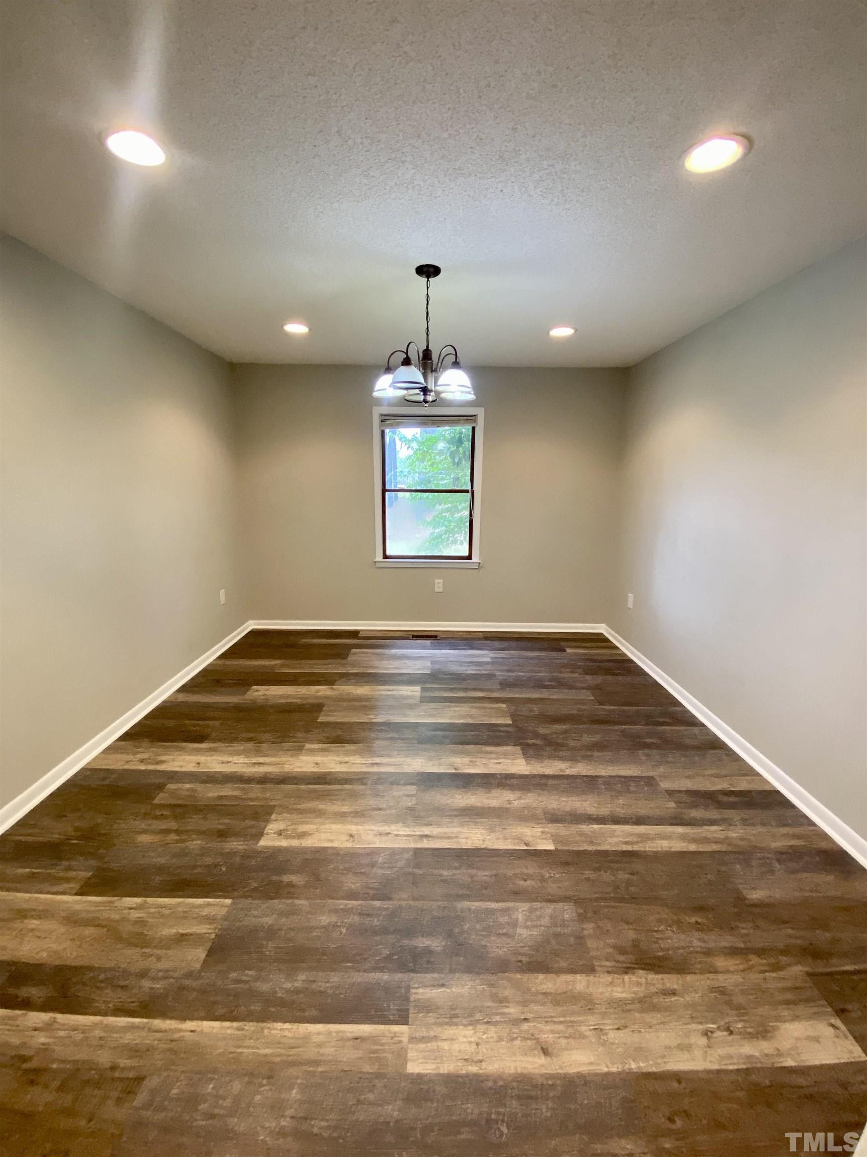 1887 Burnside Road Oxford, NC 27565 - Photo 15 of 42 a room with a chandelier