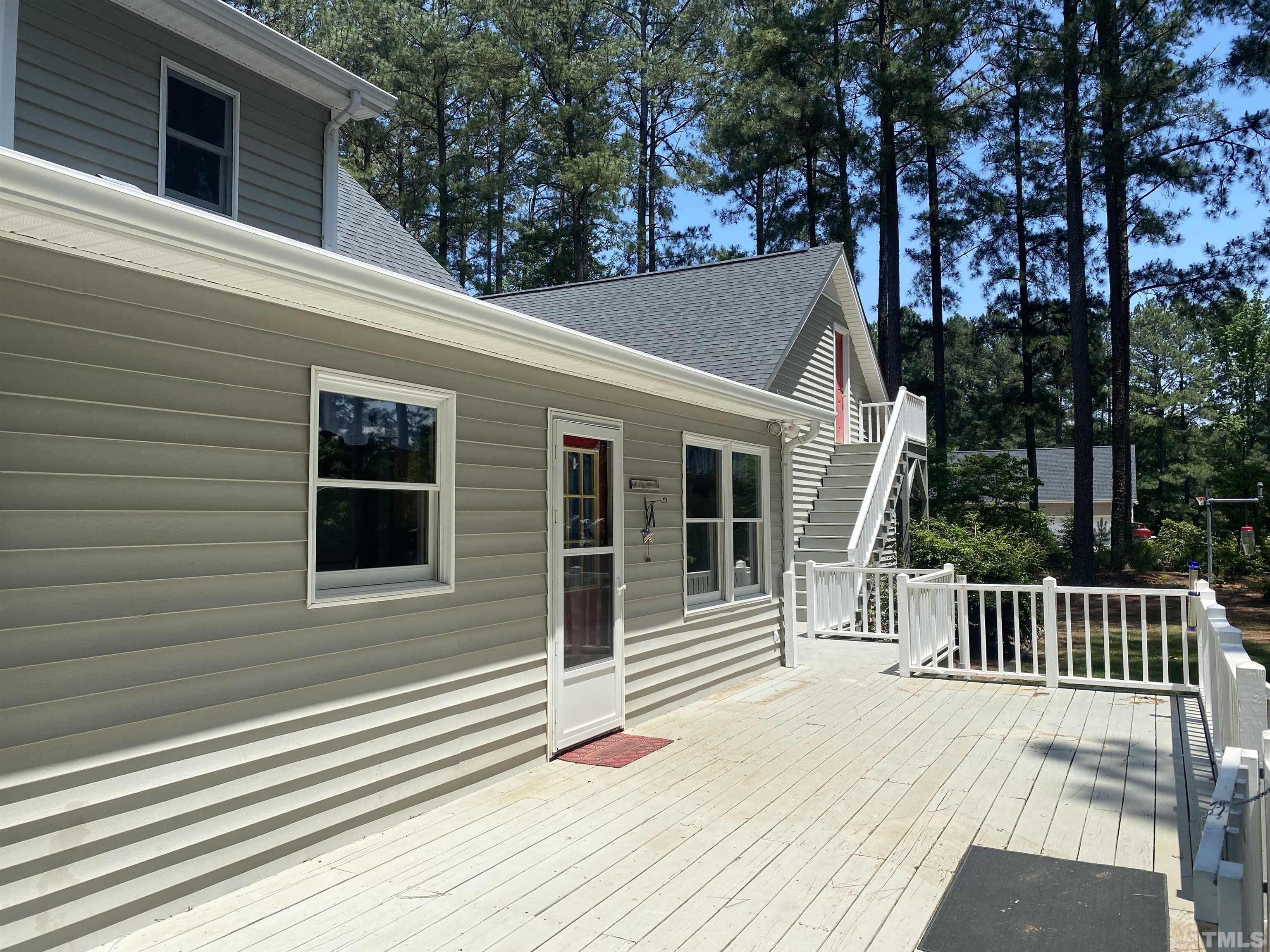 1887 Burnside Road Oxford, NC 27565 - Photo 2 of 42 a view of a house with a balcony