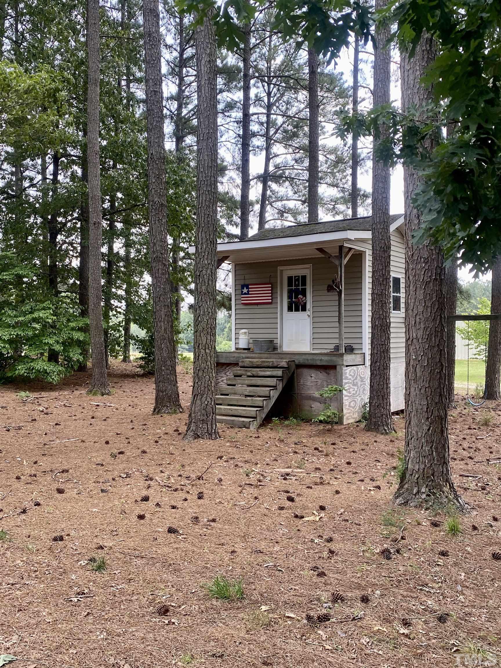 1887 Burnside Road Oxford, NC 27565 - Photo 29 of 42 a view of house with backyard and trees