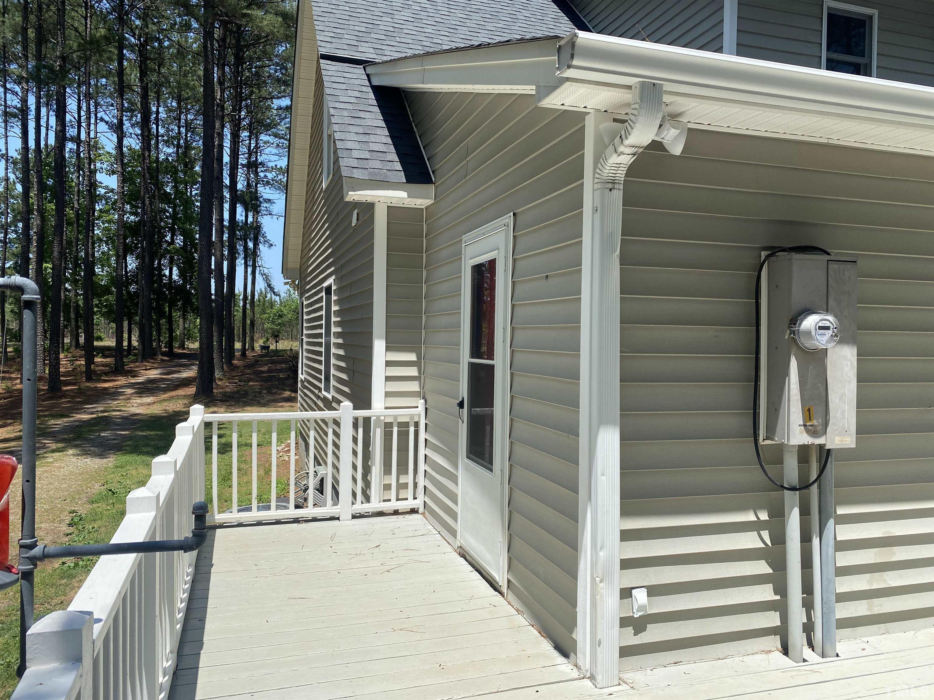 1887 Burnside Road Oxford, NC 27565 - Photo 31 of 42 a view of a brick house with large windows