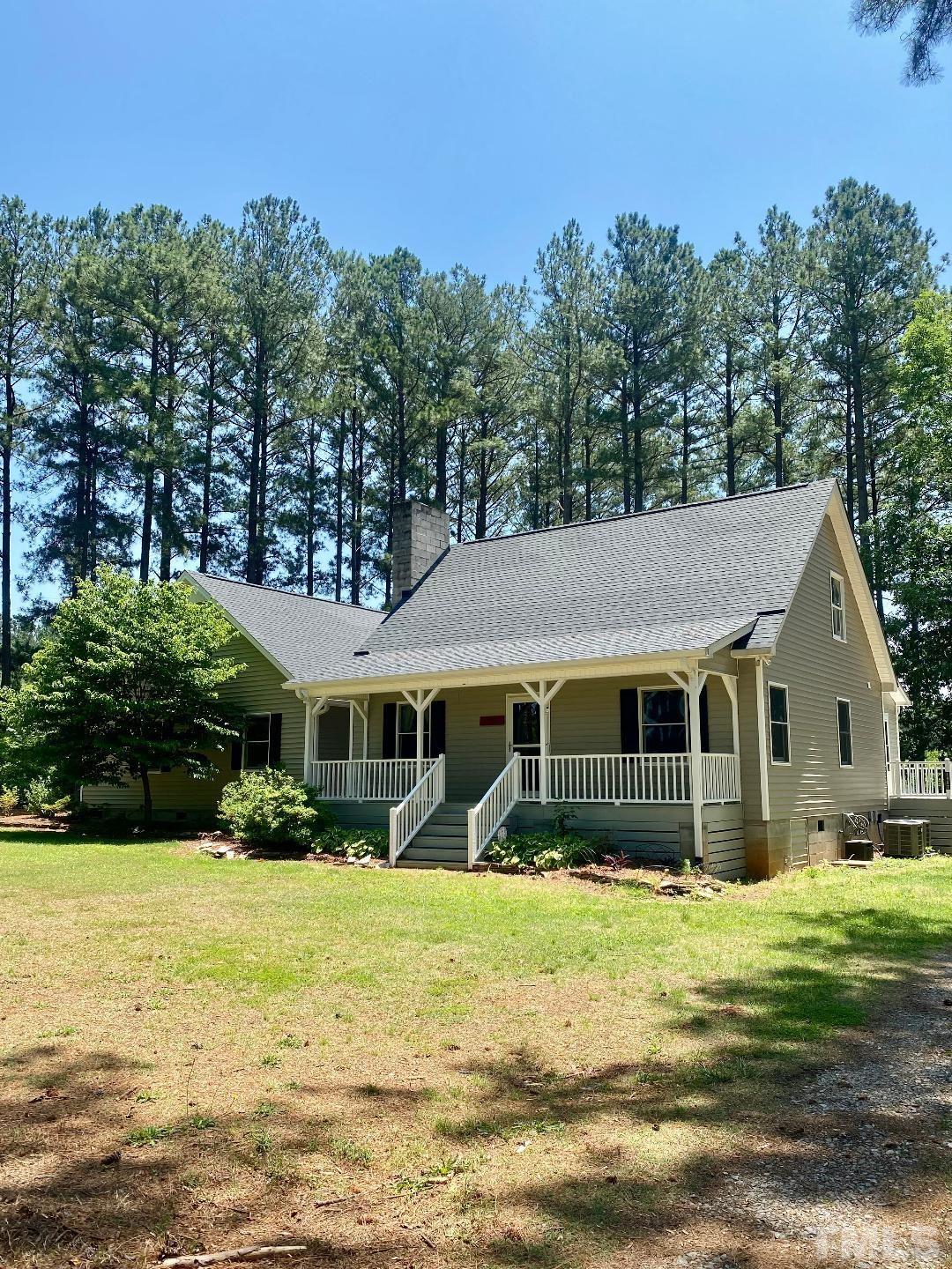 1887 Burnside Road Oxford, NC 27565 - Photo 39 of 42 a front view of a house with a yard