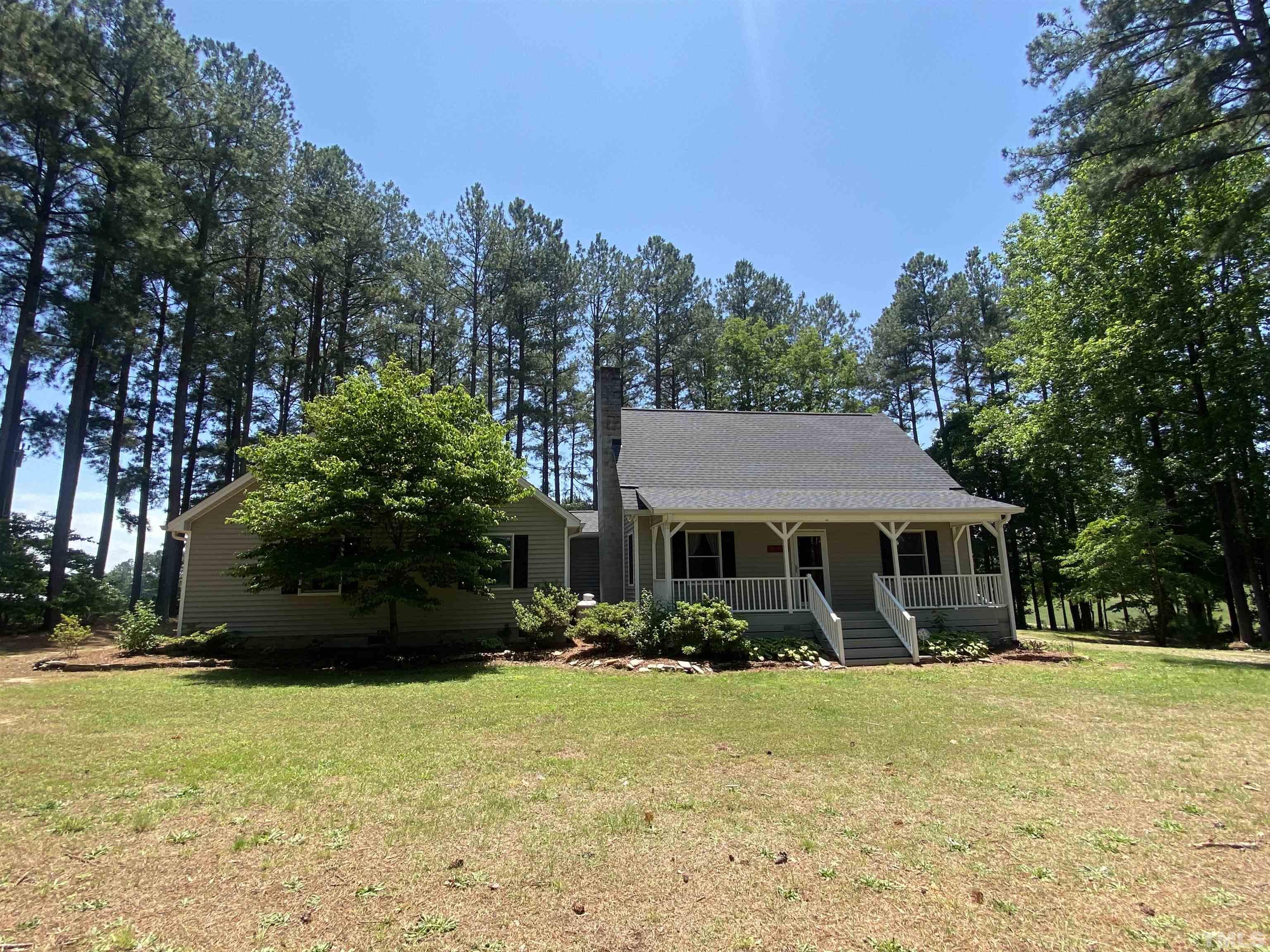 1887 Burnside Road Oxford, NC 27565 - Photo 42 of 42 a front view of a house with a yard
