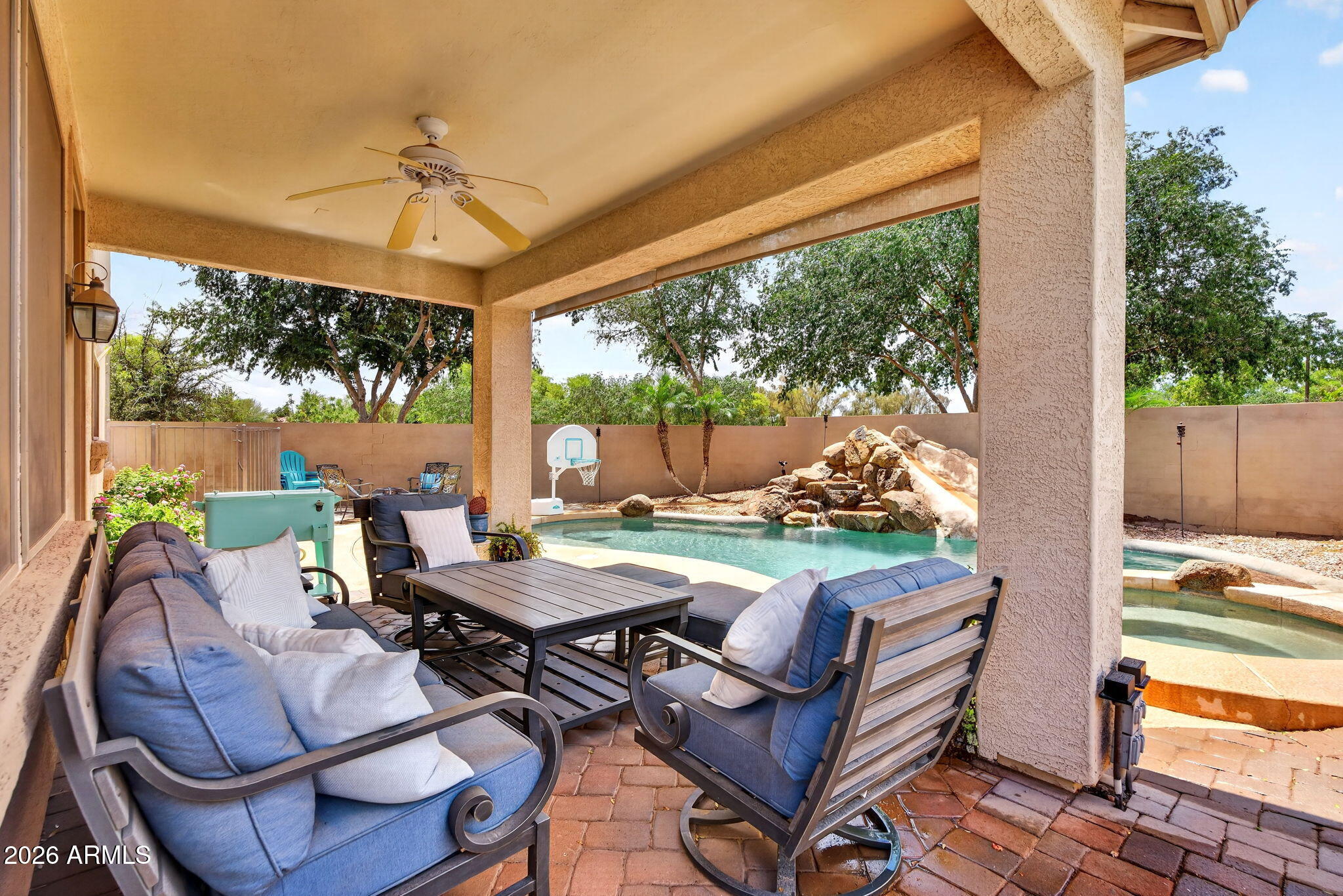 6280 South Sinova Court Gilbert, AZ 85298 - Photo 59 of 64 a outdoor space with patio the couches and a dining table with garden view
