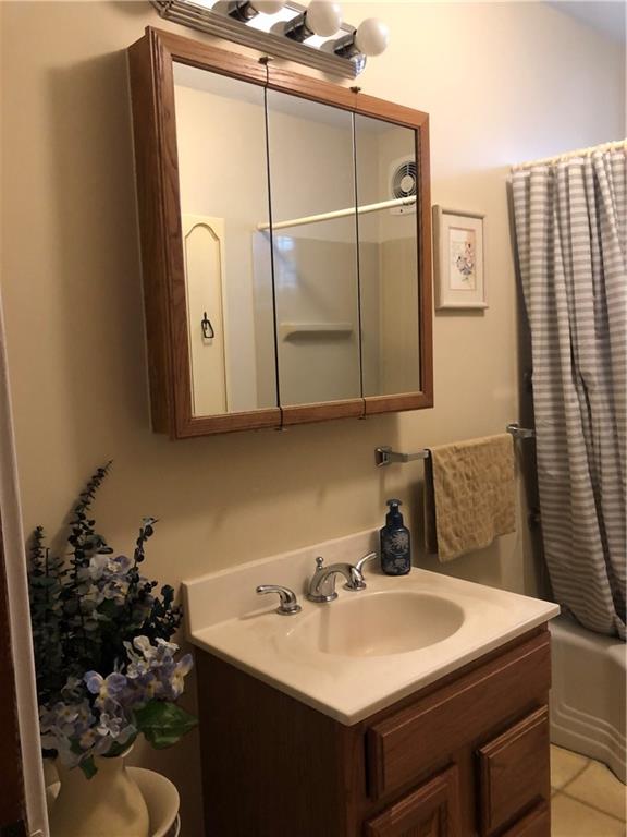 1104 13th Street Conway, PA 15027 - Photo 15 of 31 a bathroom with a sink vanity and mirror