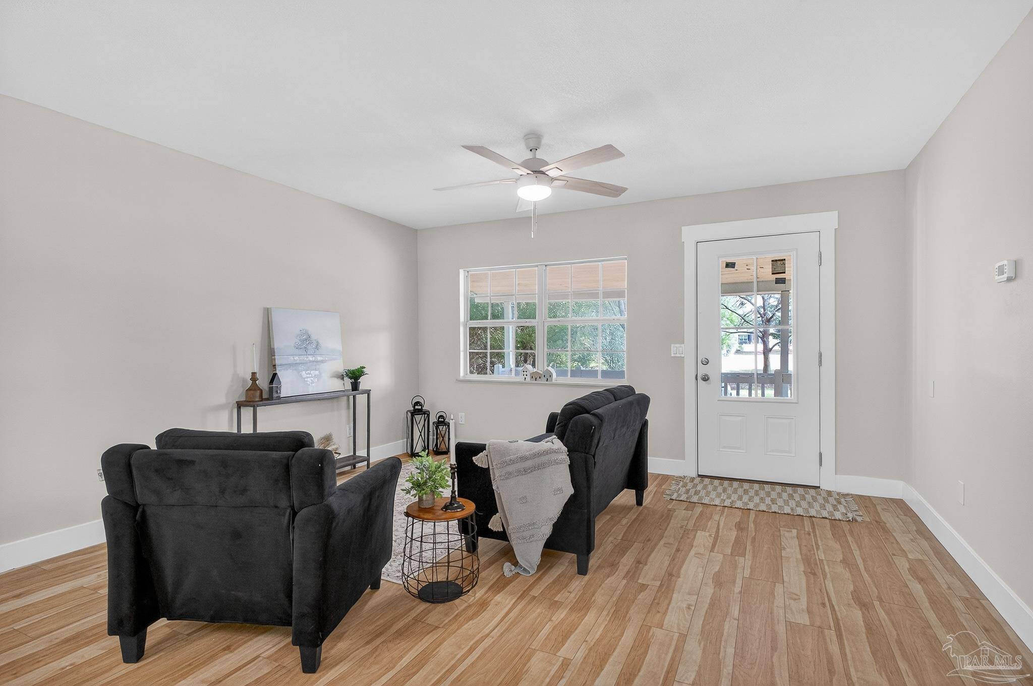 4771 Carl Booker Road Milton, FL 32583 - Photo 11 of 65 a living room with furniture and a window