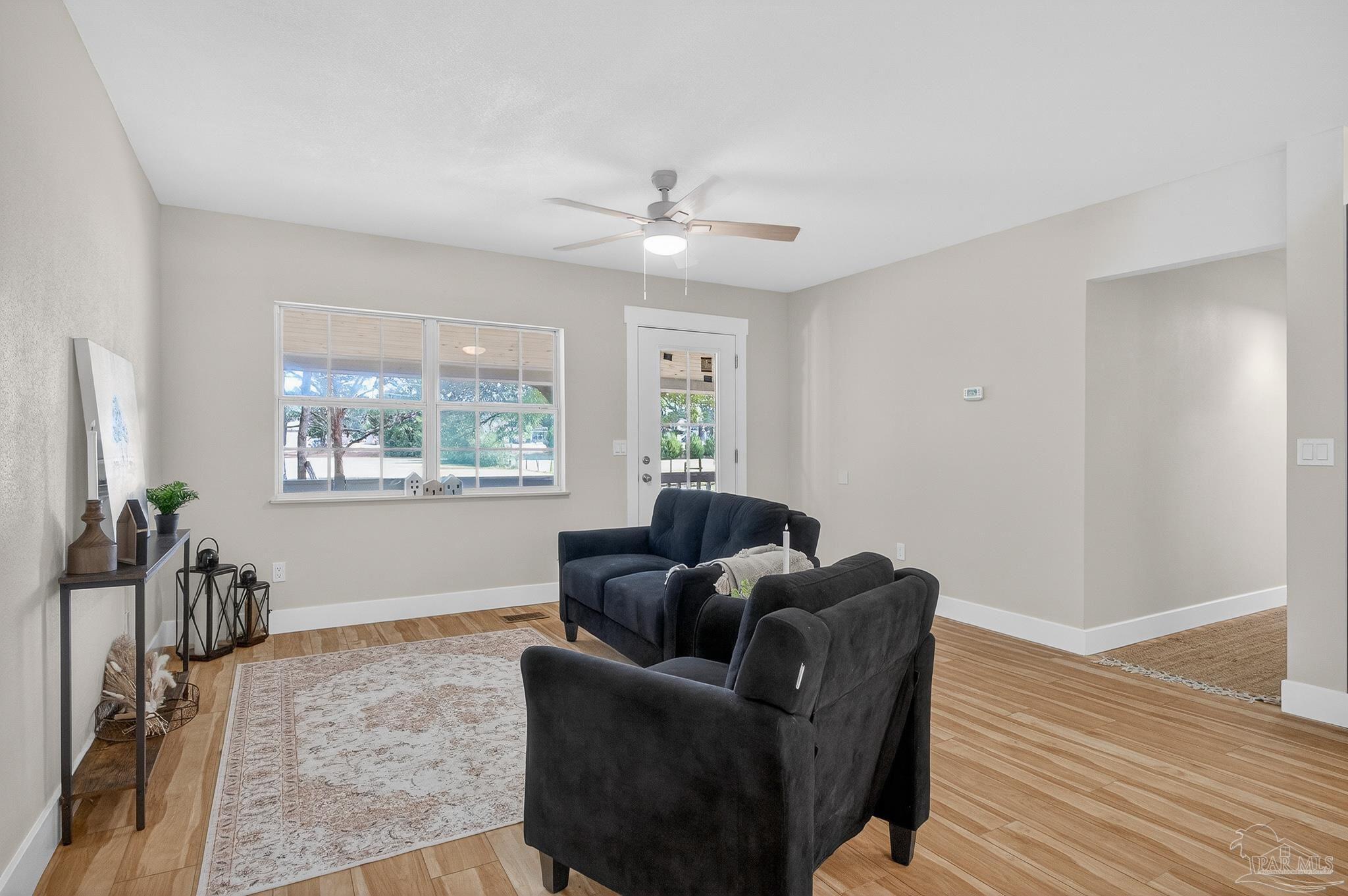 4771 Carl Booker Road Milton, FL 32583 - Photo 12 of 65 a living room with furniture and a window