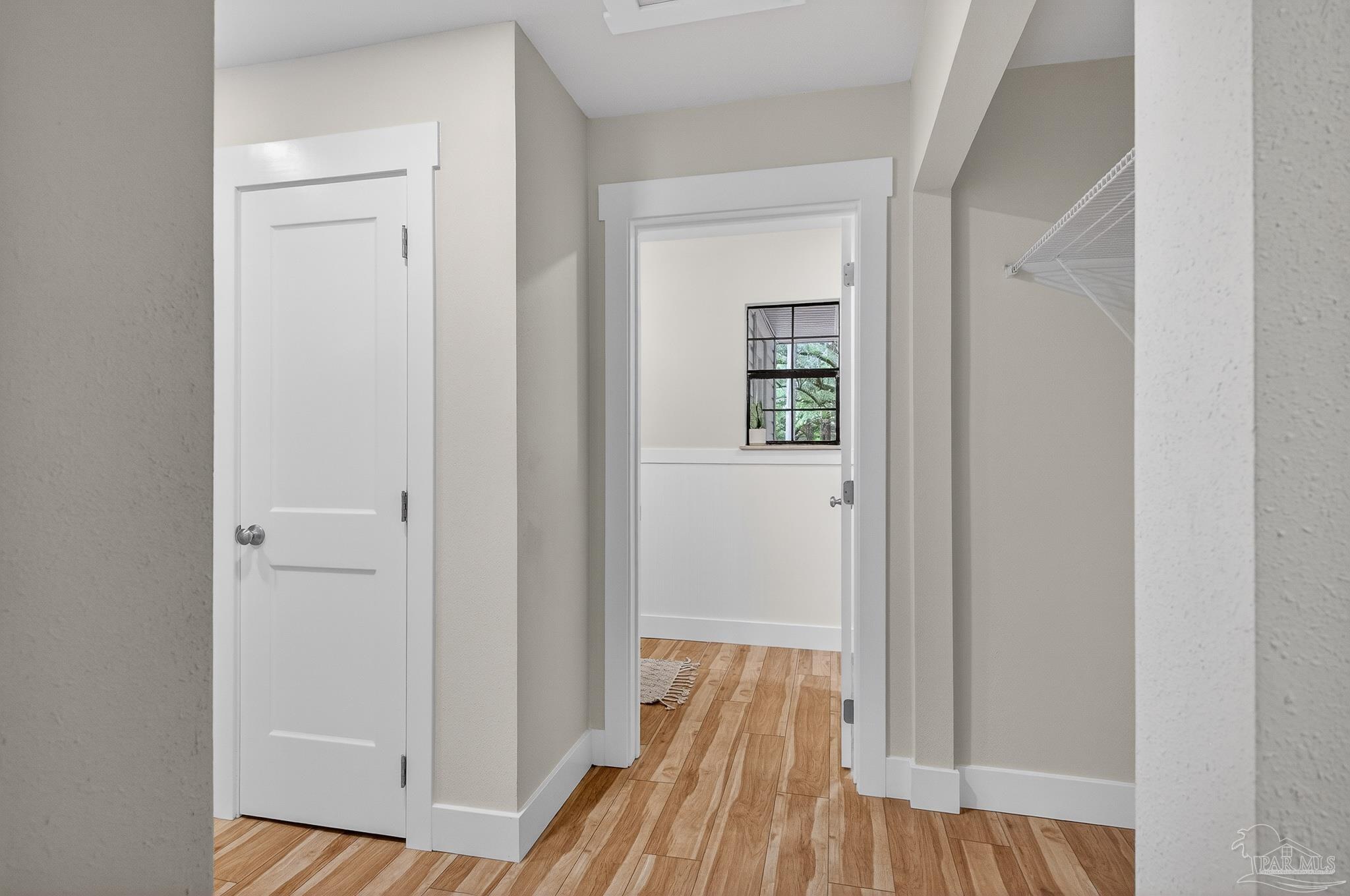 4771 Carl Booker Road Milton, FL 32583 - Photo 28 of 65 a view of a hallway with wooden floor