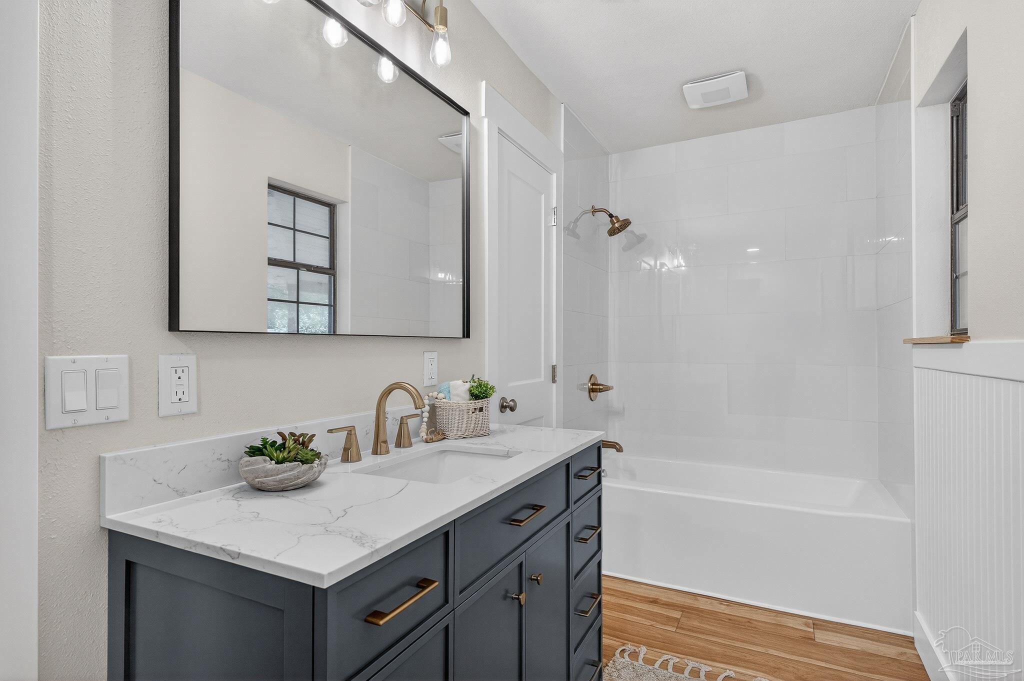 4771 Carl Booker Road Milton, FL 32583 - Photo 31 of 65 a bathroom with a sink a bathtub a shower and a mirror