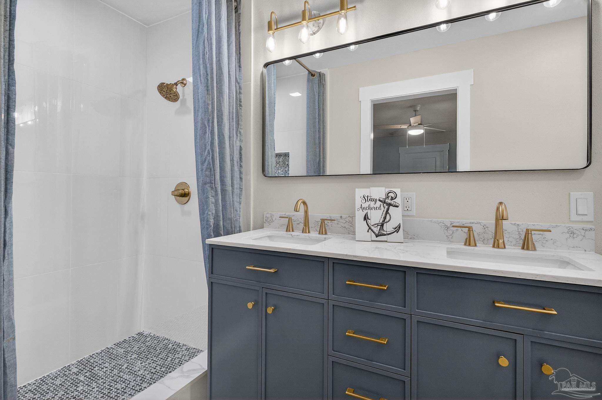 4771 Carl Booker Road Milton, FL 32583 - Photo 40 of 65 a bathroom with a granite countertop sink and a mirror