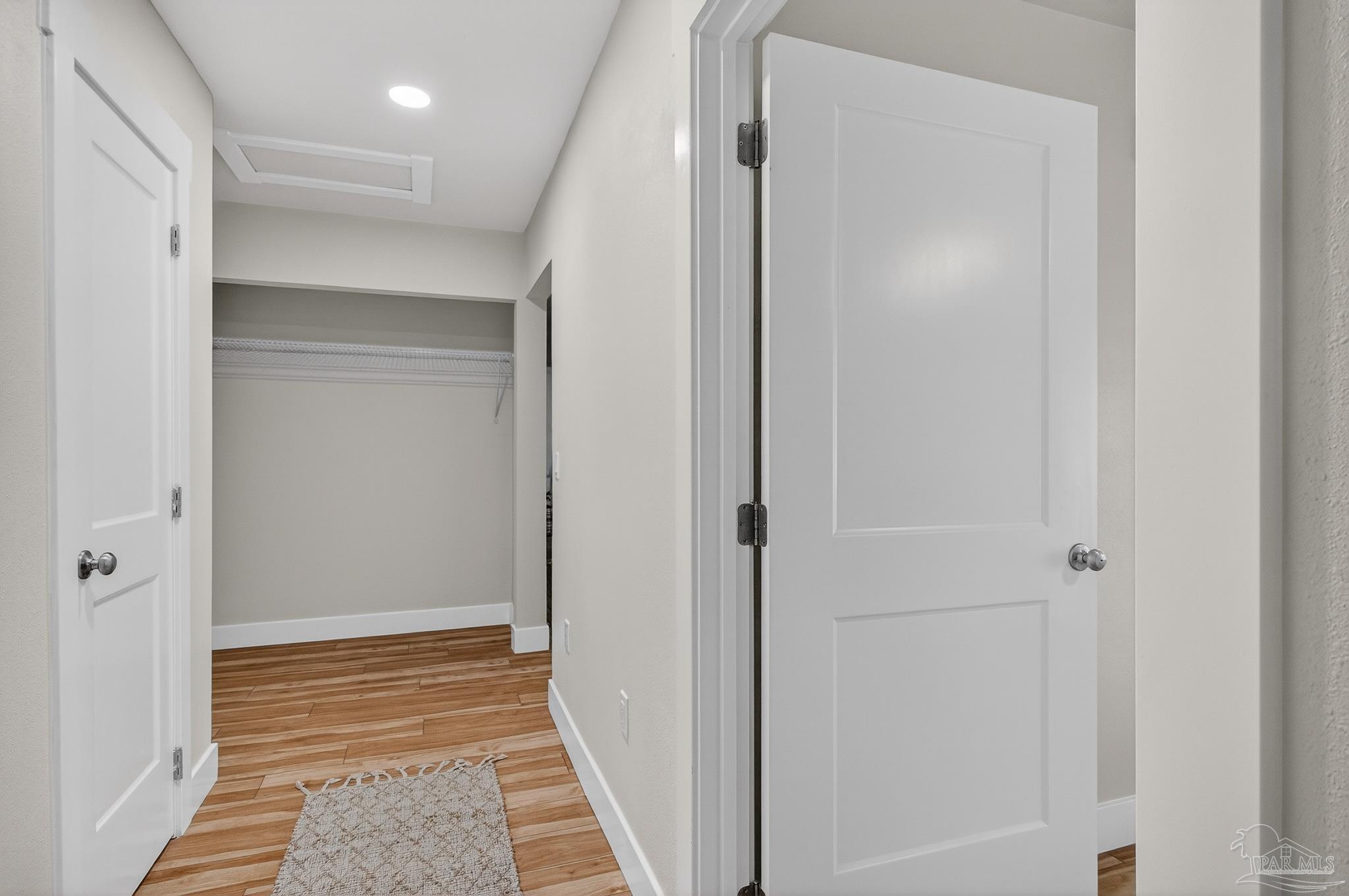 4771 Carl Booker Road Milton, FL 32583 - Photo 46 of 65 a view of hallway with wooden floor