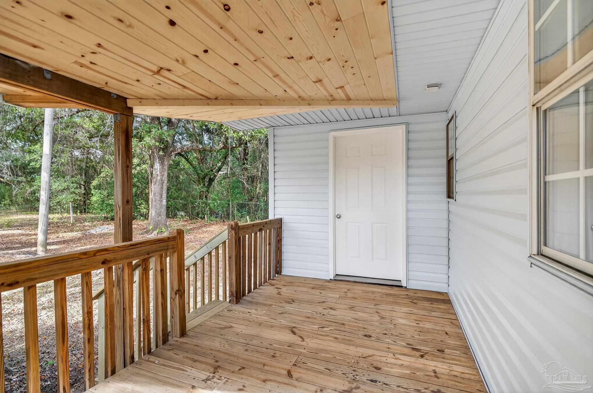 4771 Carl Booker Road Milton, FL 32583 - Photo 52 of 65 a view of a porch