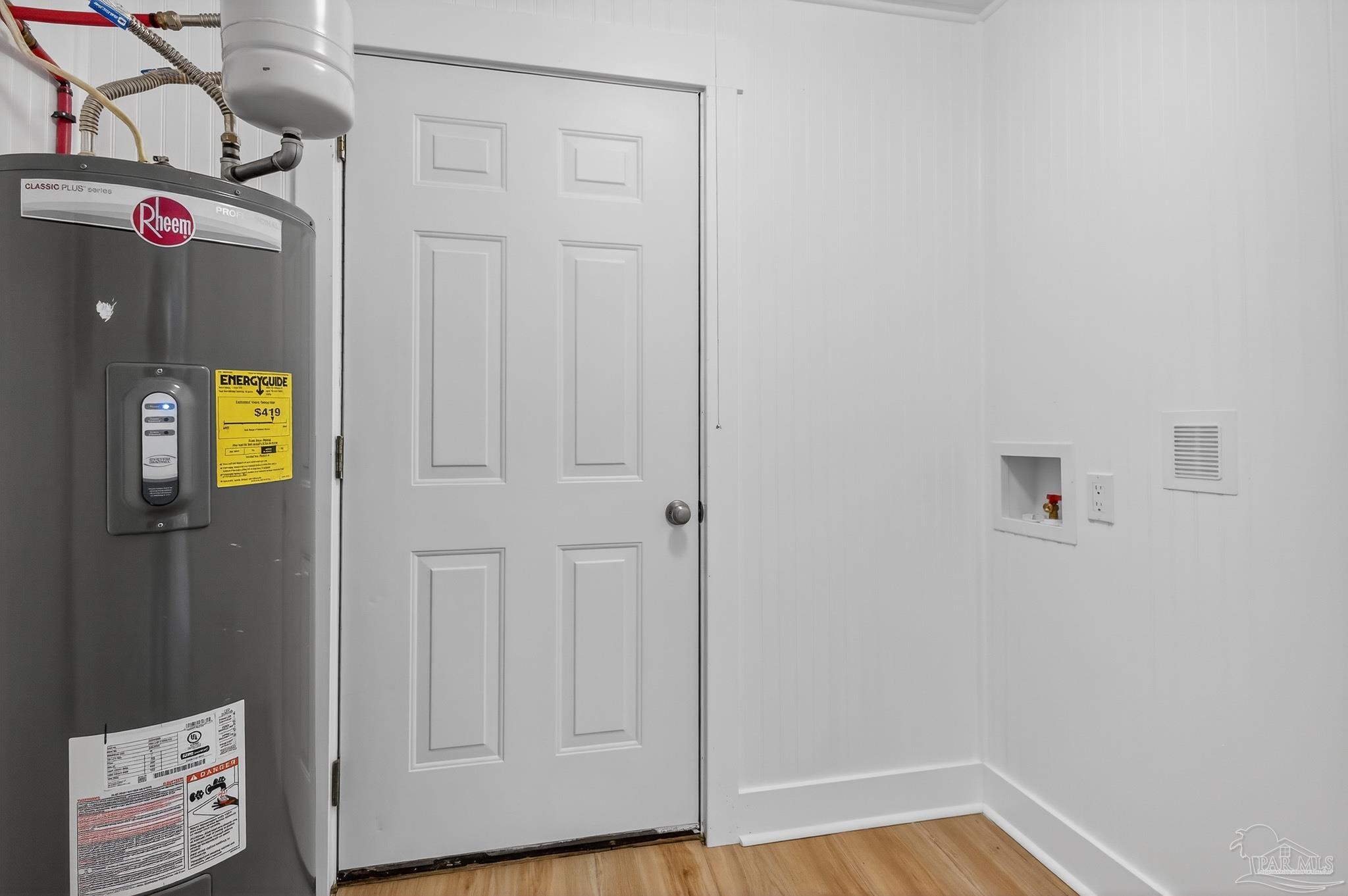 4771 Carl Booker Road Milton, FL 32583 - Photo 53 of 65 a view of a hallway with a wooden floor